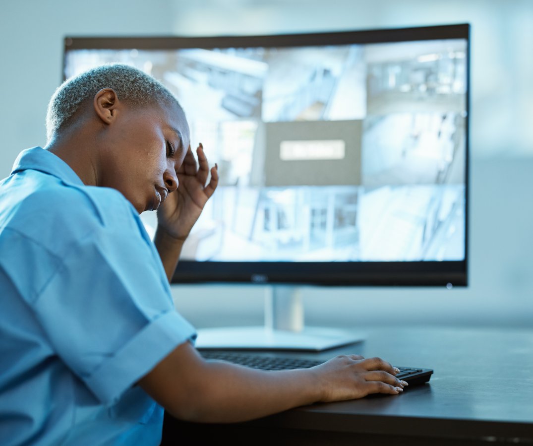 Black woman, arched back needing exercises, and headache while on computer for too long