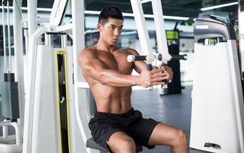 Young man exercising at gym